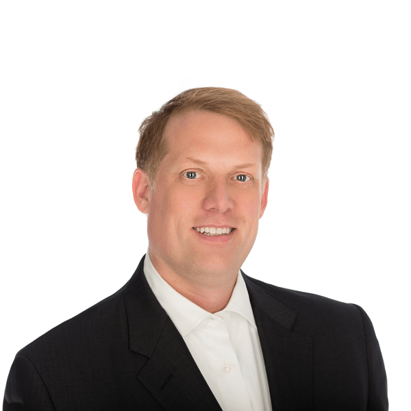 man in suit smiling at the camera