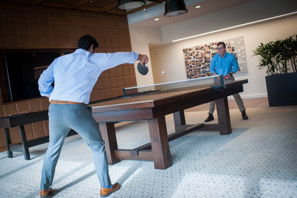 two men playing ping pong