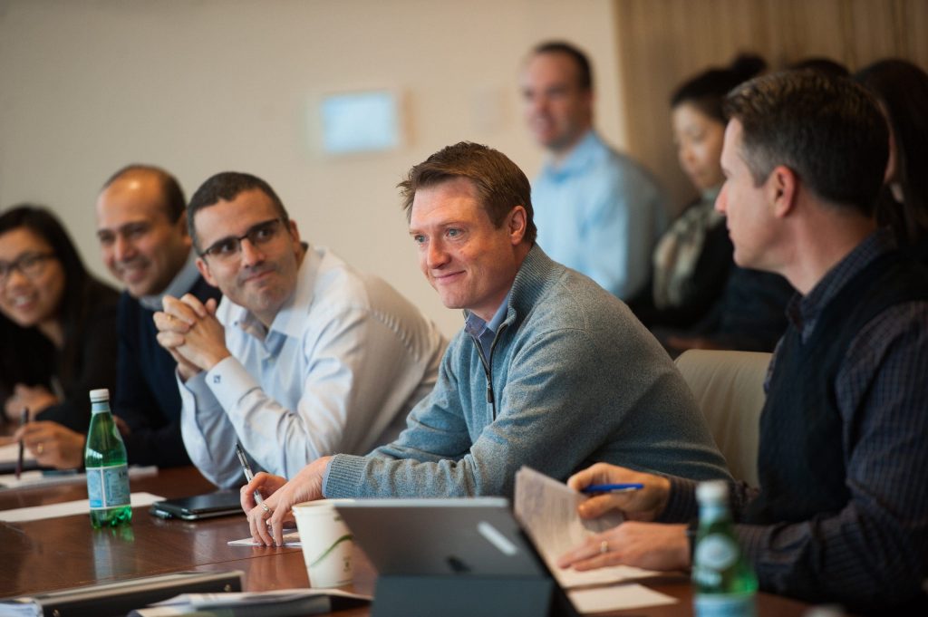 men sitting at the table at a meeting