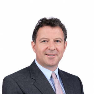 a man in a suit is smiling at the photo