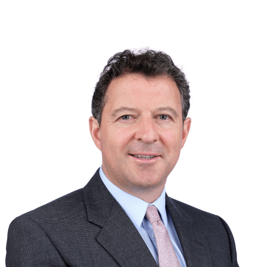 a man in a suit is smiling at the photo