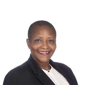 woman with short hair smiling at the camera