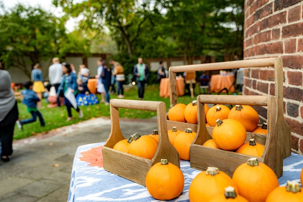 Pumpkins in a basket stacked on the table