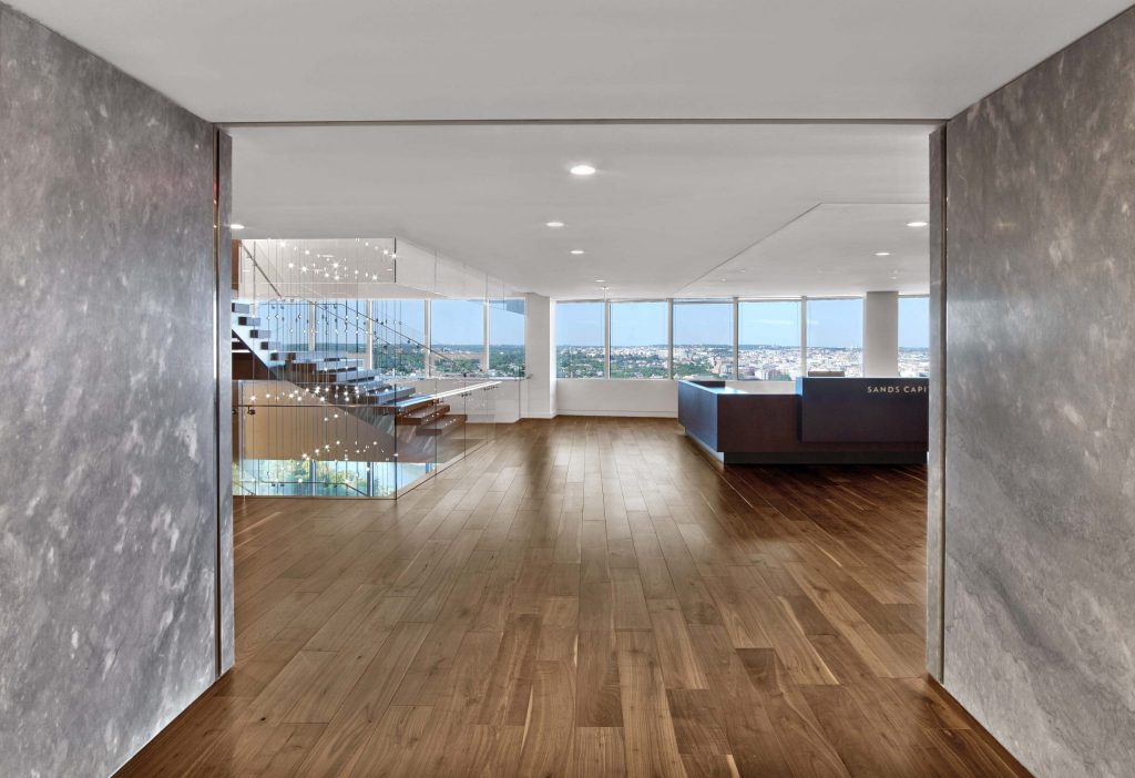 hall with a reception desk overlooking the city
